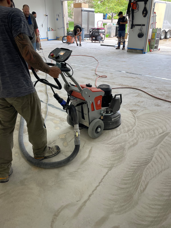 garage floor coating installation - concrete floor grinding